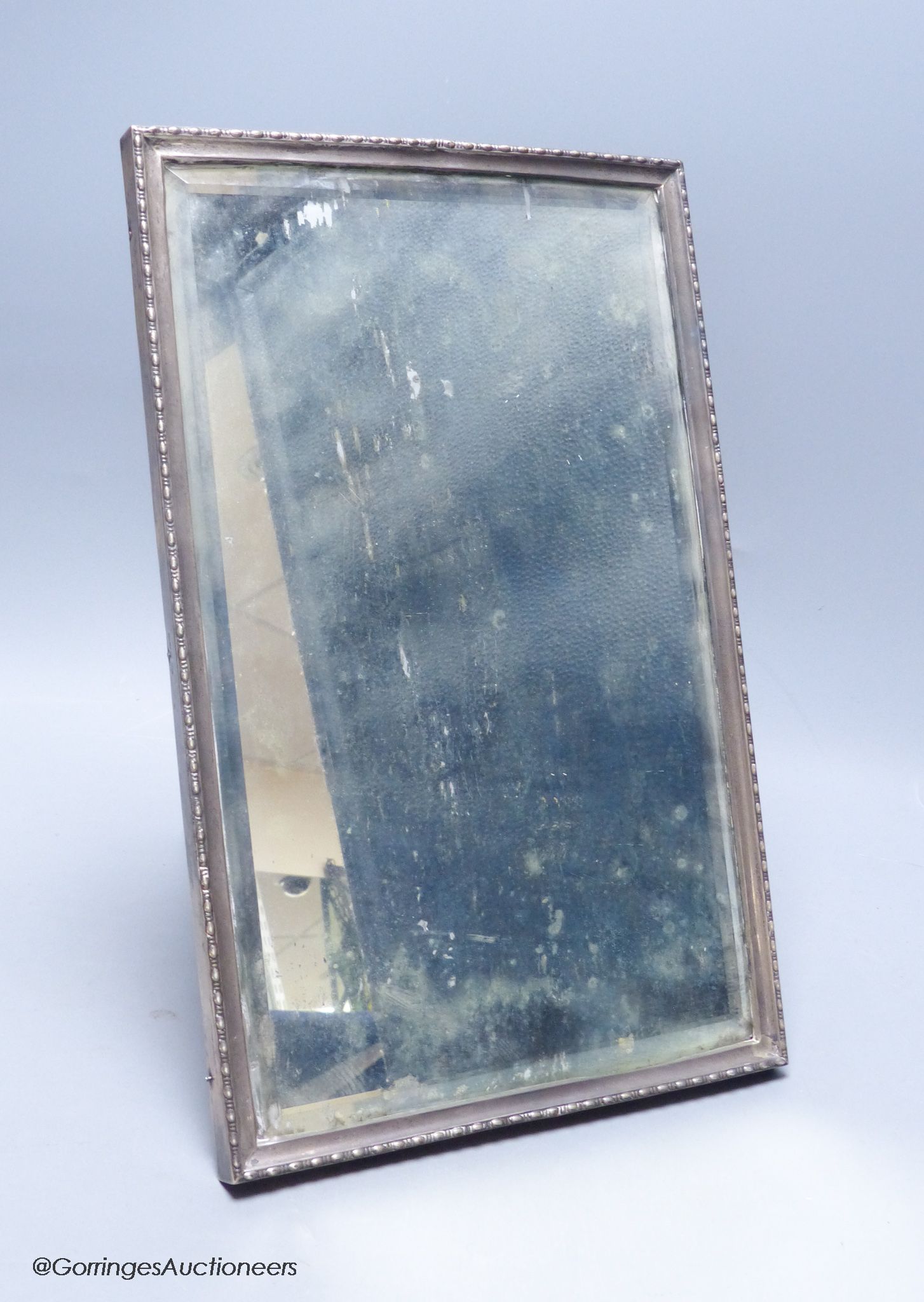 A George V silver mounted rectangular easel mirror, Walker & Hall, Sheffield, 1929, 32.8 grams.